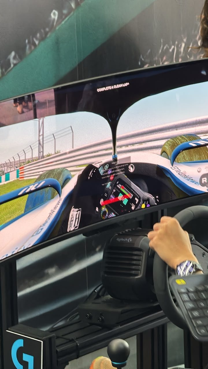 First-person racing simulator view on a Logitech-equipped rig at the Petronas F1 Malaysia activation