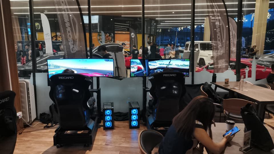 Pro-grade sim racing rigs set up for an event