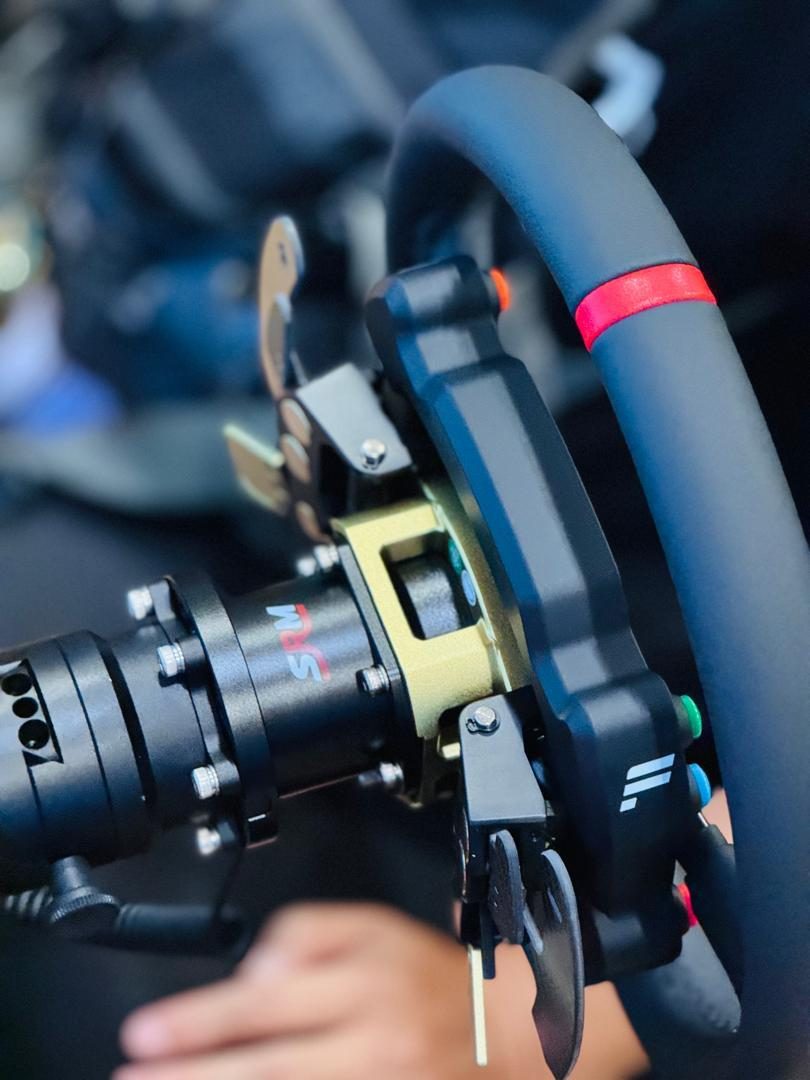 Direct-drive wheel hub quick-release on a Vertex-built sim racing rig