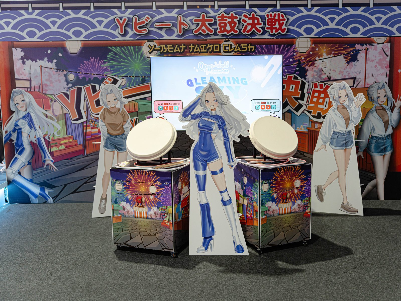Guests playing a Taiko rhythm drum challenge at a Vertex event